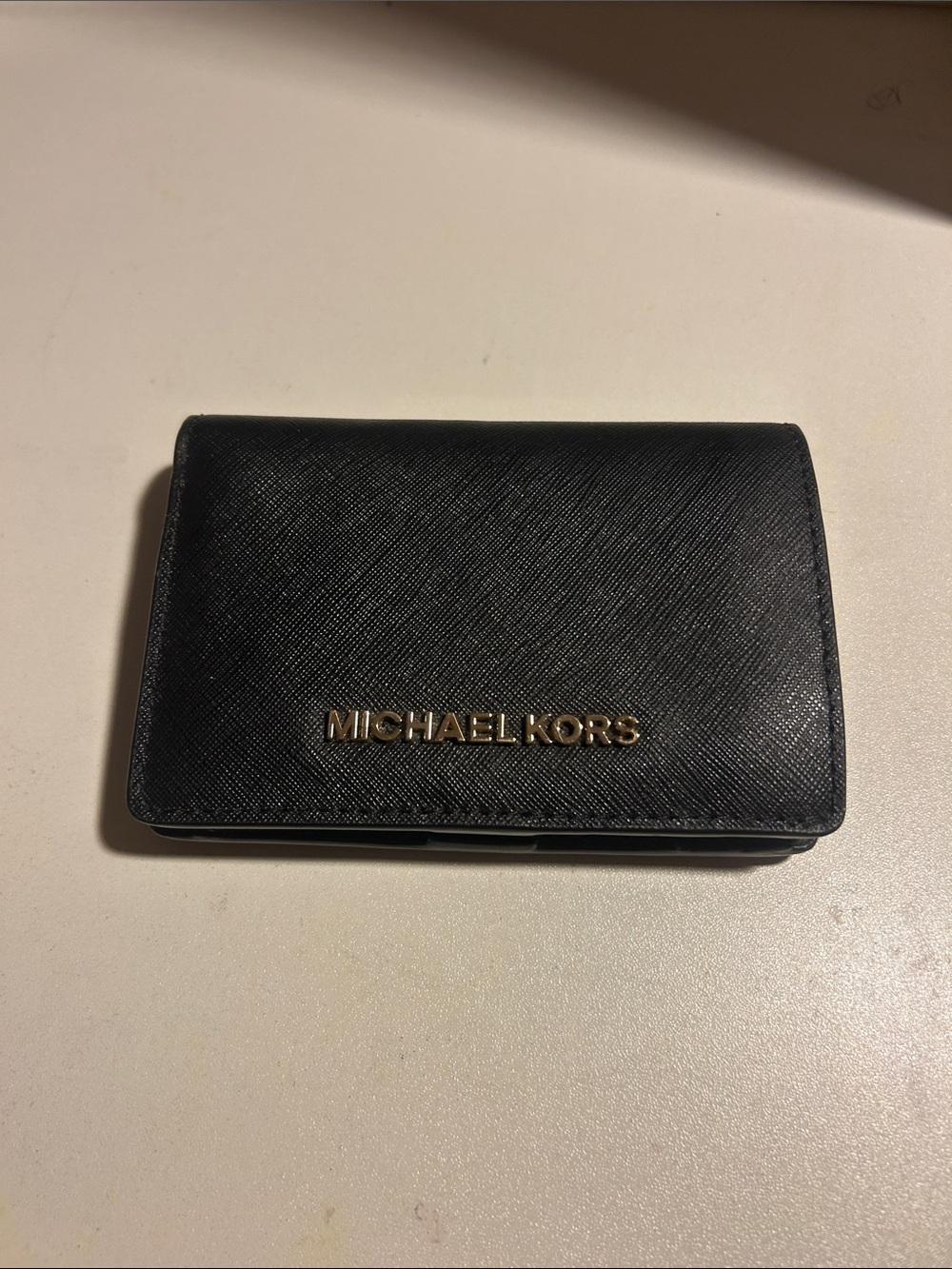 Michael Kors black saffiano-style wallet